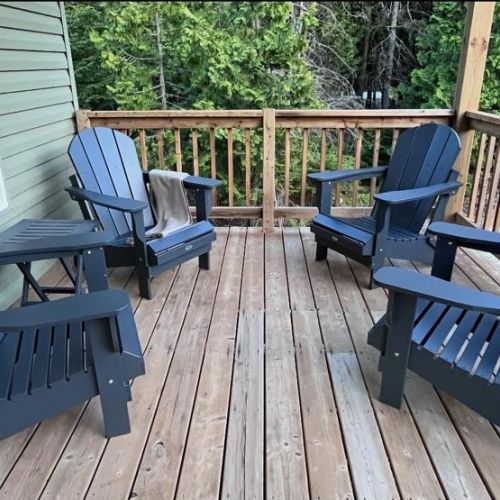Start your morning with a coffee or unwind after a day of exploring on the spacious deck. Comfortable Adirondack seating and tranquil woodland views create the ideal setting to relax and reconnect with nature.