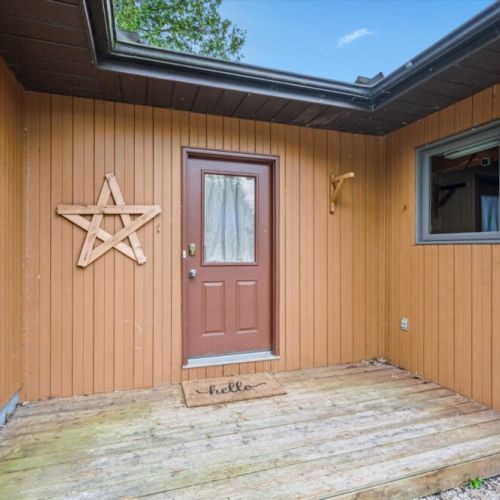 Step inside through the inviting front porch, where you’re welcomed by a simple charm and cottage warmth that begins right at the front door.