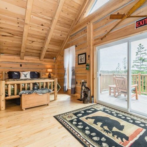 The loft provides direct access to the balcony, where you can enjoy stunning views of the surrounding nature from the comfort of your bed.