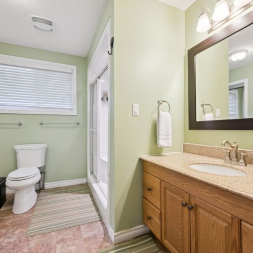 Clean, spacious bathroom with plenty of room for getting ready.