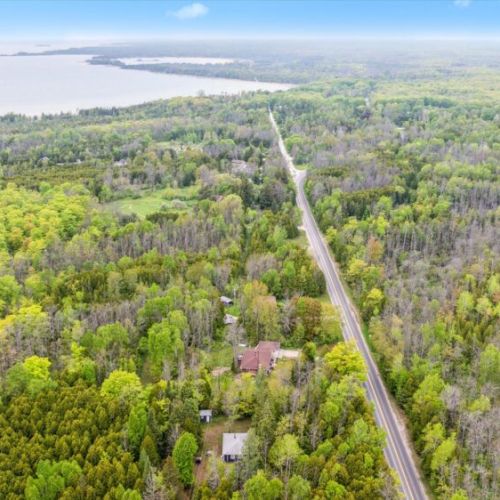 From this aerial perspective, you can see how close Chief’s Cottage is to the Lake Huron shoreline — just a short drive or bike ride away. A perfect location for combining woodland seclusion with lake adventures.