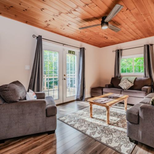 Enjoy this cozy seating nook that’s perfect for relaxing with a good book or having a quiet conversation, with natural light streaming in.