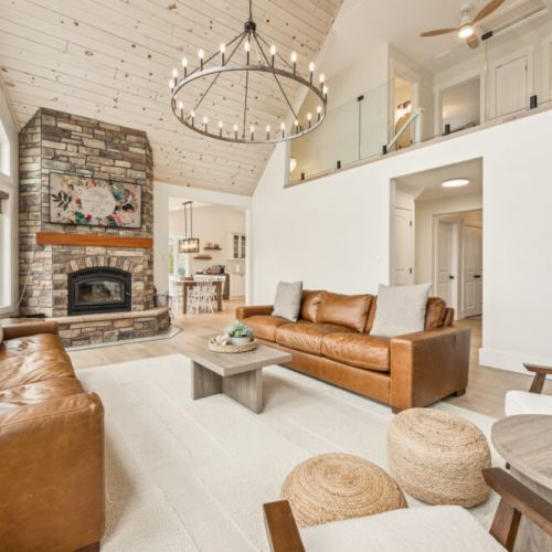Bask in natural light and panoramic forest views from the vaulted-ceiling great room—your scenic cottage getaway awaits.