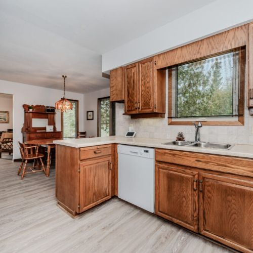 Prepare and share meals in a spacious kitchen and dining area overlooking nature—perfect for relaxing evenings at your vacation rental.