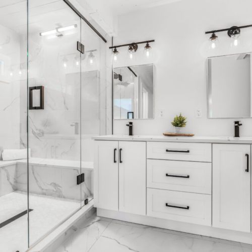 Bright modern vanity area with plenty of storage for group stays.