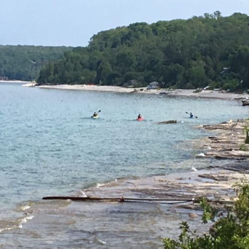 Guests enjoying the calm waters just steps from the cottage.