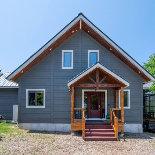 A warm welcome—charming front entrance with rustic wood accents.