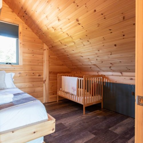 Upstairs bedroom: Crib in the upstairs bedroom.