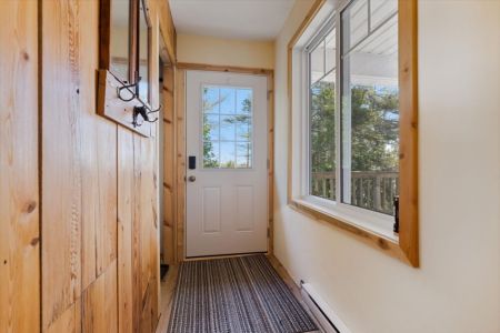 Kick off your shoes and settle in. The bright entryway offers plenty of space for jackets, boots, and all your adventure gear.