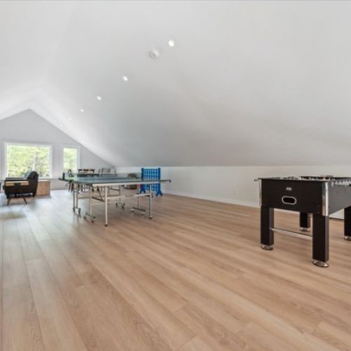 Endless entertainment awaits in this airy loft, complete with ping pong, foosball, and plenty of room for games, lounging, and family fun.