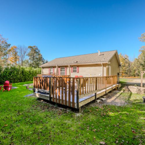 Step outside to enjoy the large backyard, perfect for relaxing by the fire pit, hosting barbecues, or simply taking in the serene surroundings.
