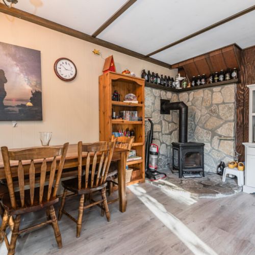 Grab a book or game off the shelf, the dining table makes a great games space with the cozy fireplace nearby.